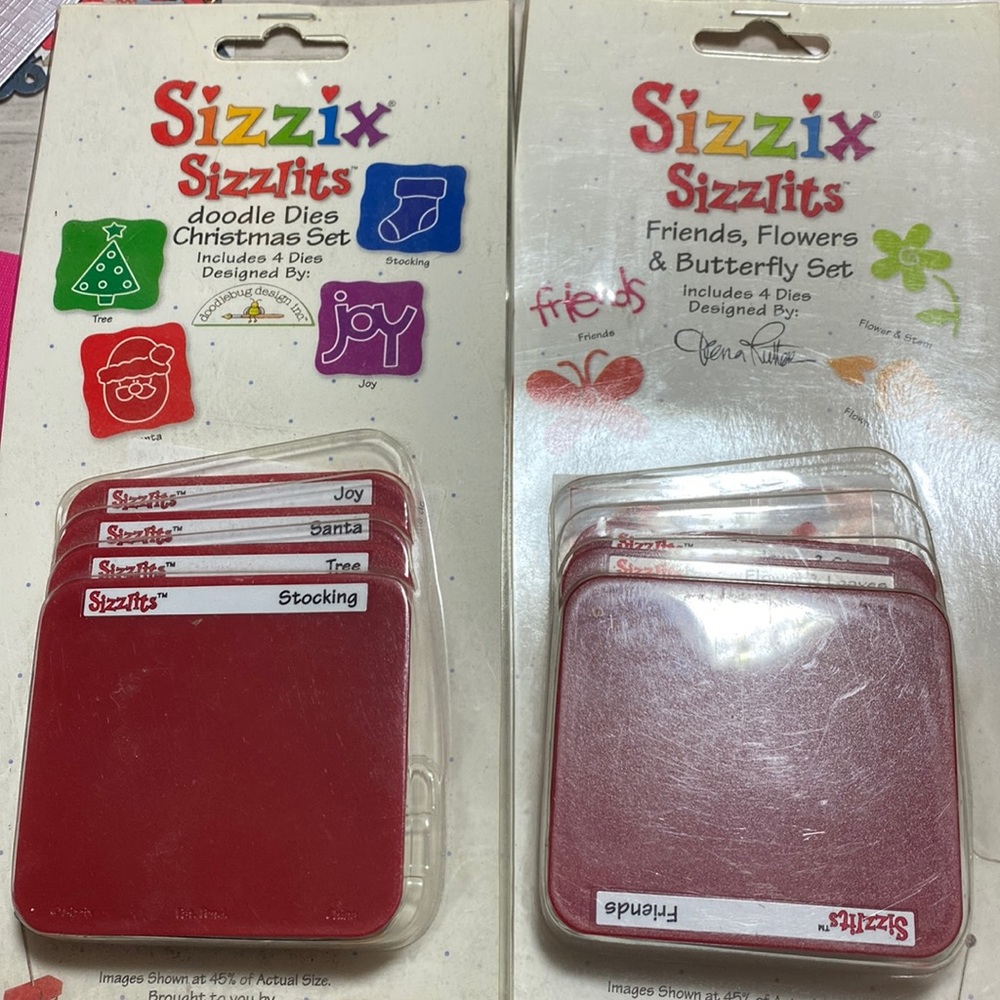 Set of two sizzix sizzlits sets. Holiday and friend.